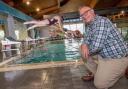 Cllr Gareth Dadd pictured with Thirsk White Horse swimmers ready to go to great lengths thanks to the arrival of their new diving blocks