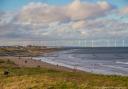 Looking down to the turbines at Redcar, from the coast road by Pat Blewitt