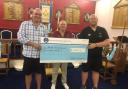 Members of the Lodge present the cheque