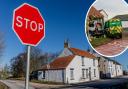 Improvement works at a notorious crossroads where cars have crashed into the same house nine times in the last two decades have been completed.