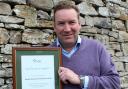 RECOGNITION: Graeme Newton, of Randall Orchard Construction Ltd, with the certificate