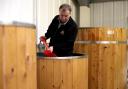 SPADE WORK: David Wall shovelling hops in the beer brewing vats