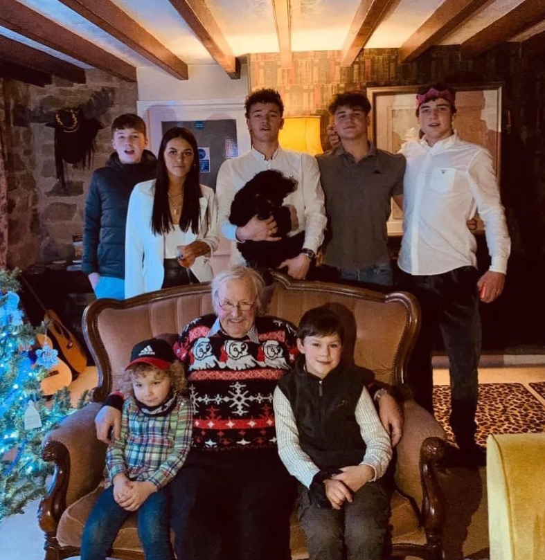 Tony Howard with his seven grandchildren