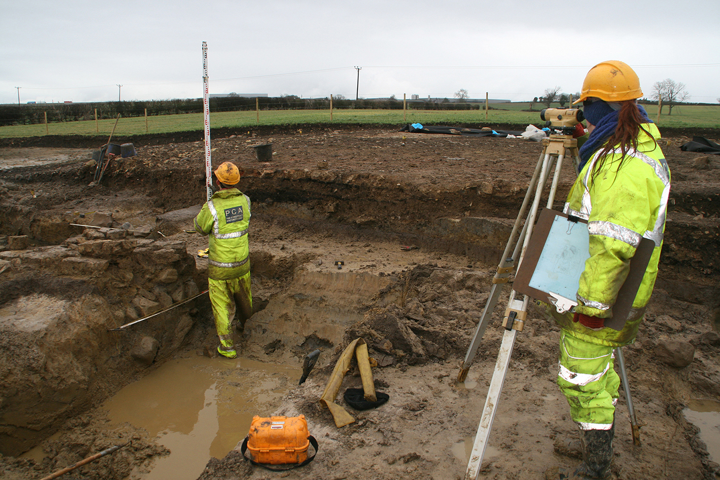 Archaeologists survey the site