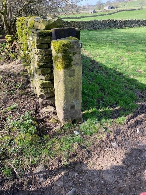 A carved post in Coverdale