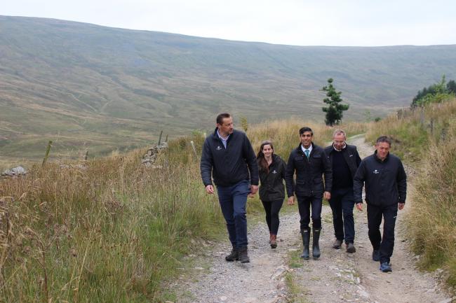 Rishi Sunak with Woodland Trust staff at Snaizeholme, near Hawes, where 250,000 trees are to be planted to help combat global warming
