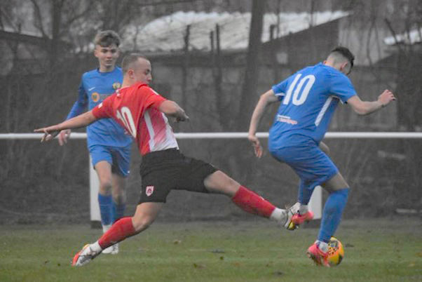 Striker Louis Johnson stretches to win the ball from a Whickham defender Picture: DAN CLARK