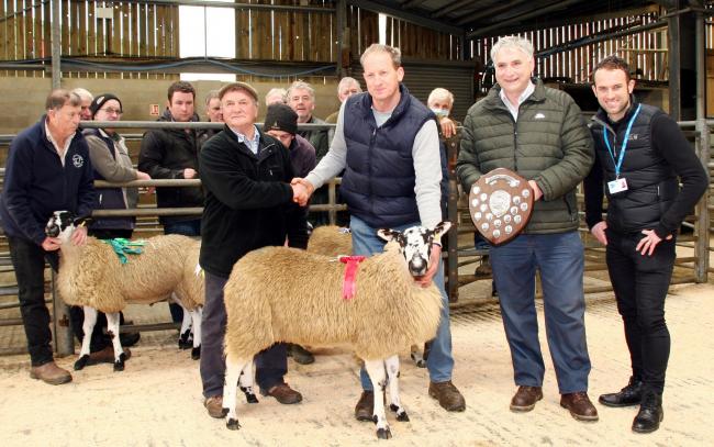 Joe Throup with his Addingham Sheepbreeders’ charity lamb champion, being congratulated by co-judge John Stott, joined by fellow judge Thomas Binns and Manorlands’ fundraiser Adam Brunskill, right