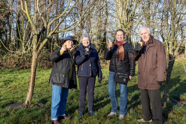 Darlington and Stockton Times: EPICH volunteers prepare the orchard ahead of the wassail: (Left to right, Pat Simpson, Judith Redfern, Lyn Wylie, and Ken Pattison. Picture: Chris Barron
