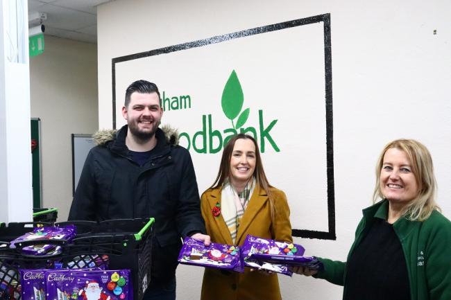 Neil Marsden, sales and marketing director at Pickerings Lifts with staff of the foodbank