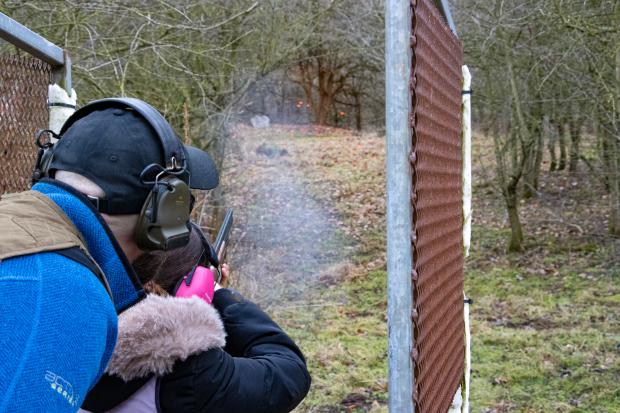 Phil Masters coaching junior member Olivia Hall, 12, as she hits a clay at Marne Clay Shooting Club. Picture: Chris Barron