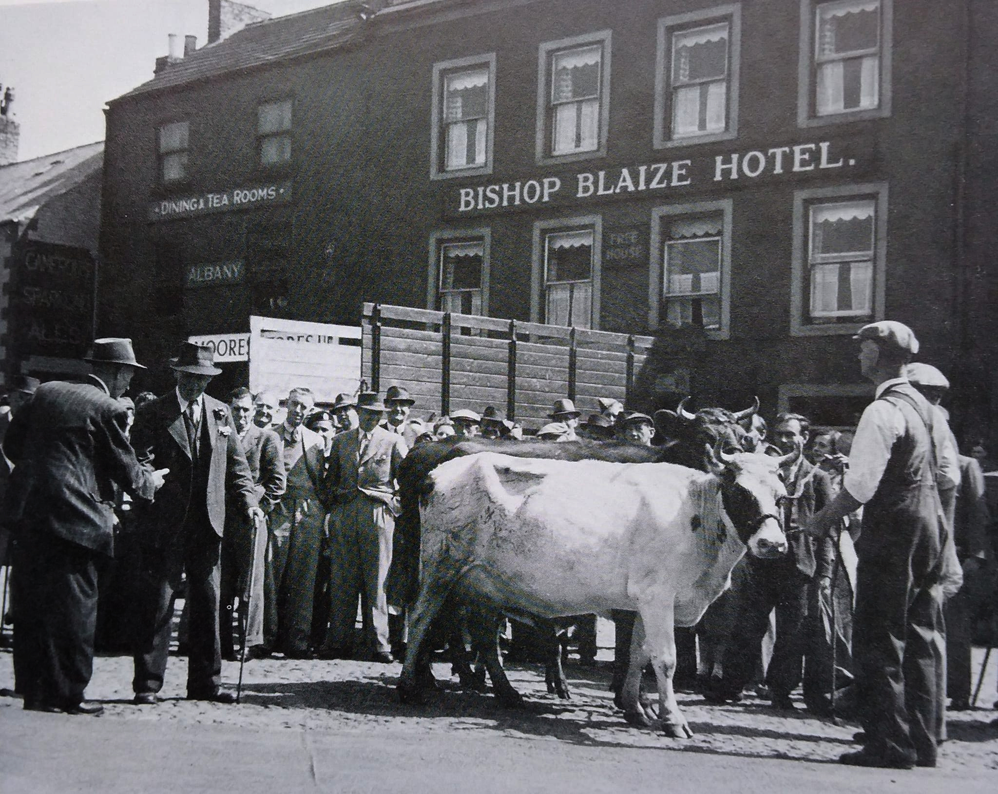 Richard Lawson, who was born at the Good Intent, is the tall chap at the back in the centre of the picture wearing a hat. It is market day outside the Bishop Blaize Inn in Richmond Market Place