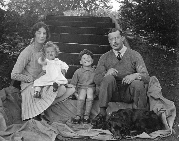 Darlington and Stockton Times: George Pease as a baby with his parents, Veronica and Joseph, and older brother, Joseph to whom the Radio 4 bongs are dedicated, on steps in the grounds of Swale House, Richmond, in 1927
