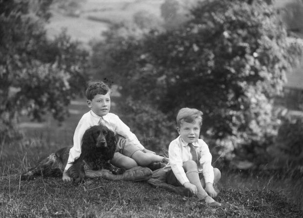 Darlington and Stockton Times: A professional photograph of Joseph and George Pease, and Boss the dog, in the early 1930s