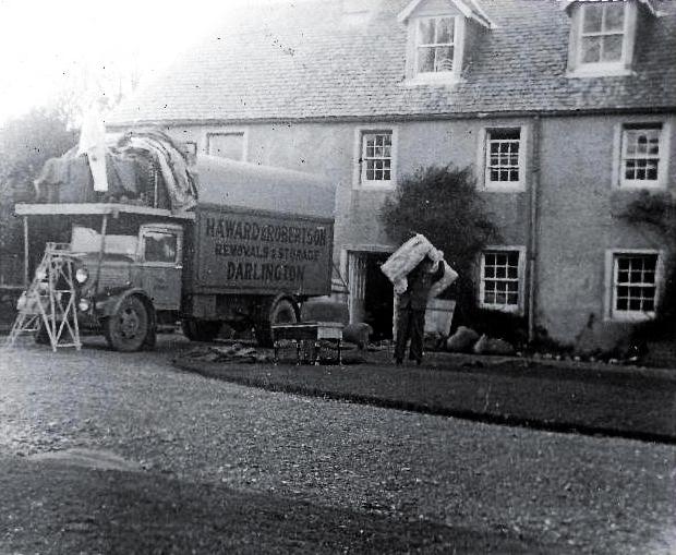 Darlington and Stockton Times: Haward & Robinson, Darlington's famous removal company, unloading the Peases' possessions at Taynish in October 1935 as they moved from Gainford to Scotland