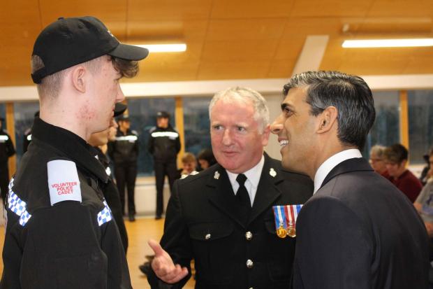 Rishi Sunak and Insp Mark Gee talk to cadet Lewis Normanton of Scorton at the passing out parade event