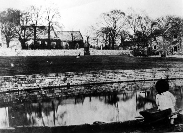 Darlington and Stockton Times: An Edwardian postcard showing the pond at the bottom of the green and the church in the distance. The pond was fed from the overspill from the pant, which was once the village's main water supply