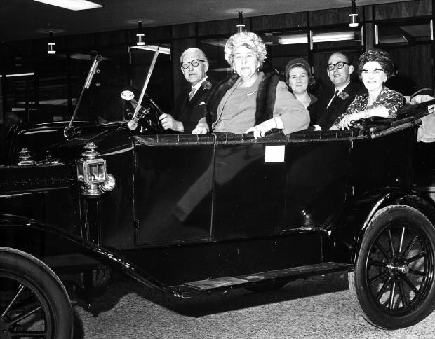 Darlington and Stockton Times: John Neasham and Lady Starmer in the new garage's reception area on opening day in the company's Model T Ford