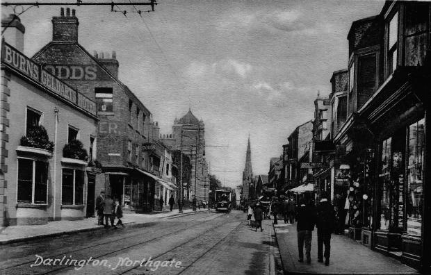 Darlington and Stockton Times: A view north up Northgate, with a tram approaching the cameraman. On the left hand side is the pretty Burns Hotel which was about where Boots is today