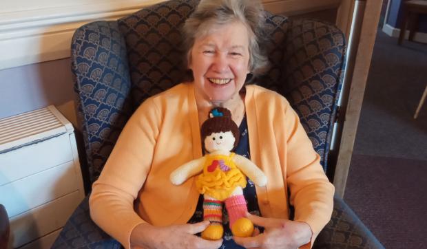 Darlington and Stockton Times: Hazelgrove Court Care Home resident Dot Paling, 78, with one of the dolls she made for the display at Emmanuel Church