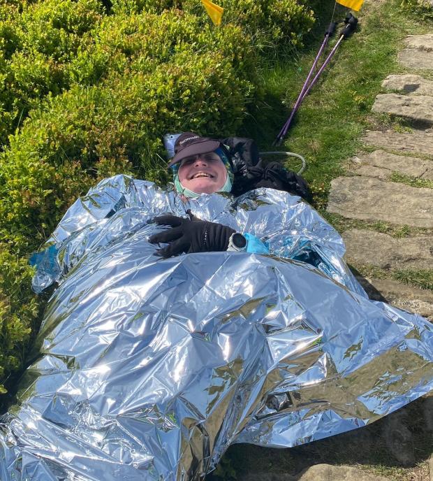 Darlington and Stockton Times: Injured runner Sarah Norman awaits rescue, wrapped in foil blankets to keep warm