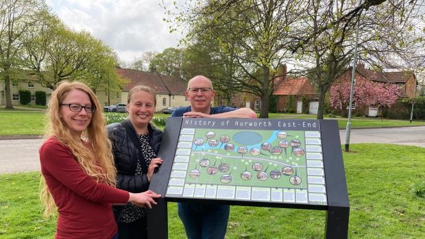 Darlington and Stockton Times: Artist Jaime Westwood, parish councillor Lynn Wylie and Chris Lloyd with the new history board on Hurworth Green