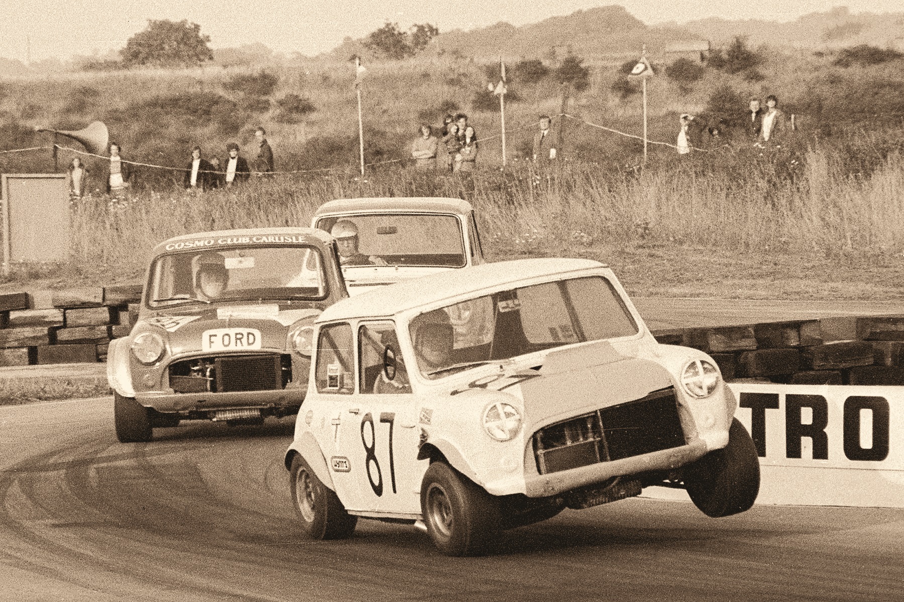 One of the famous BBC Show races at Croft in 1972: Andy Barton (999cc Mini Cooper S) leads Sedric Bell (MAE Ford-engined Mini) and Alex Clachers Hillman Imp through the chicane