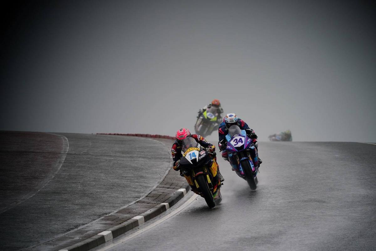 Davey Todd leads eventual winner Alastair Seeley in Thursday’s wet Supersport race