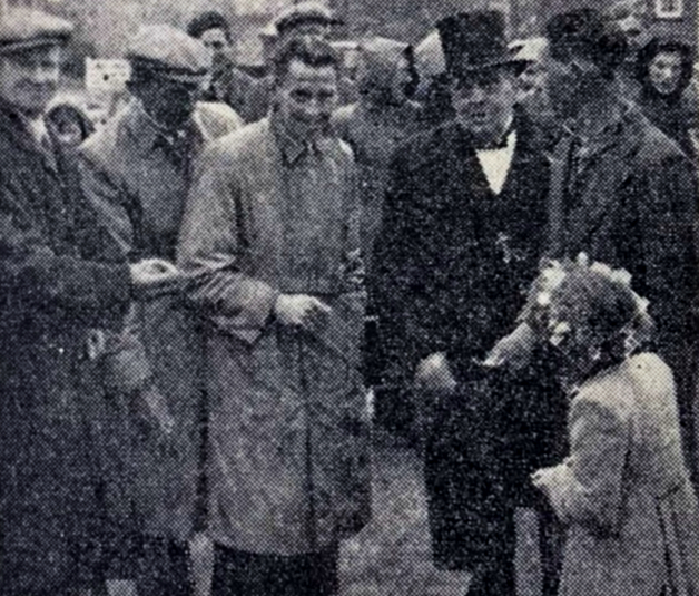 A man dressed as Winston Churchill inspects Sawa Rebrows haircut at Fearby on Coronation Day