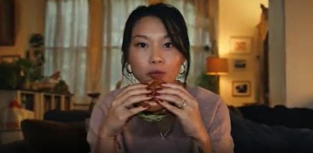 Darlington and Stockton Times: A shot from the now banned Tesco advert of a woman eating a burger (Tesco/PA)