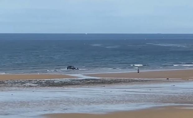 Darlington and Stockton Times: The car gets submerged at Saltburn beach on Tuesday (June 21). Picture: INCIDENTS ON TEESSIDE & COUNTY DURHAM 