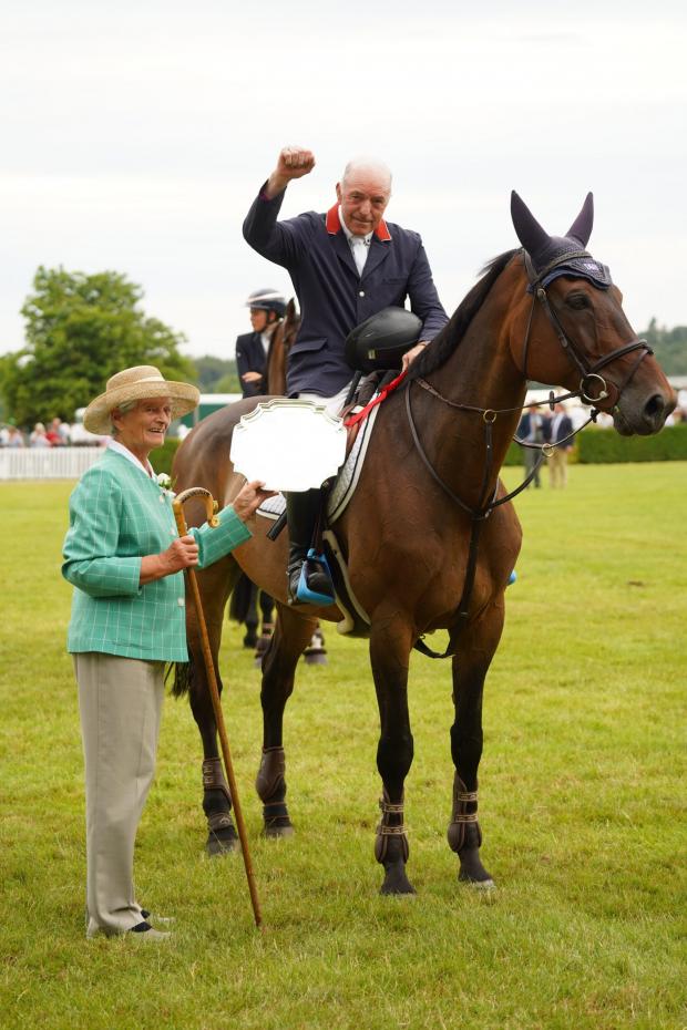 Darlington and Stockton Times: John Whitaker winning in the William Hanson Stakes presented with the winners salver by President Margaret Chapman. Picture: GYS