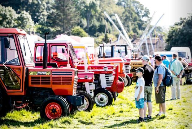 Darlington and Stockton Times: Admiring the machinery on display at Reeth Show Picture: Sarah Caldecott