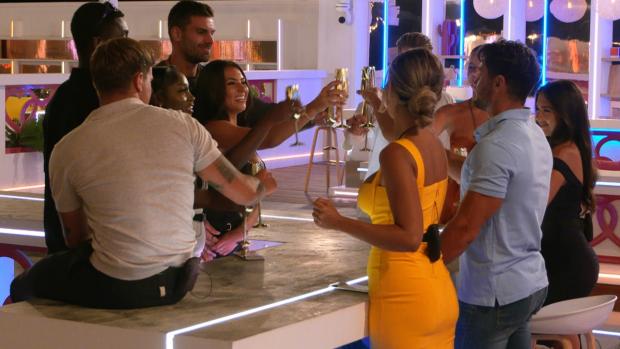 Darlington and Stockton Times: The islanders make a toast. Love Island continues tonight at 9pm on ITV2 and ITV Hub. Episodes are available the following morning on BritBox (ITV)