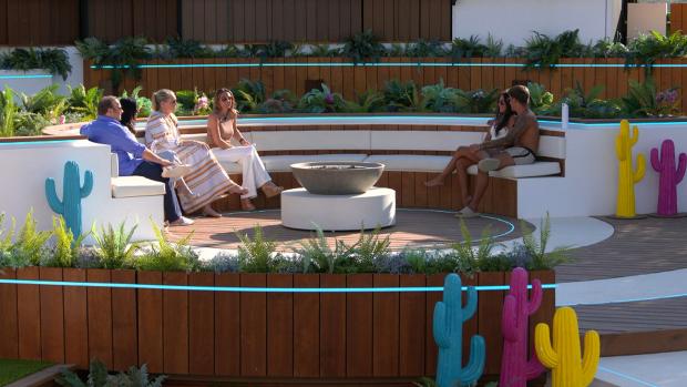Darlington and Stockton Times: Gemma and Luca at the fire pit with their families. Love Island continues tonight at 9pm on ITV2 and ITV Hub. Episodes are available the following morning on BritBox. Credit: ITV