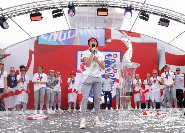 Darlington and Stockton Times: England players sing Sweet Caroline on stage during a fan celebration to commemorate England's historic UEFA Women's EURO 2022 triumph in Trafalgar Square PA 