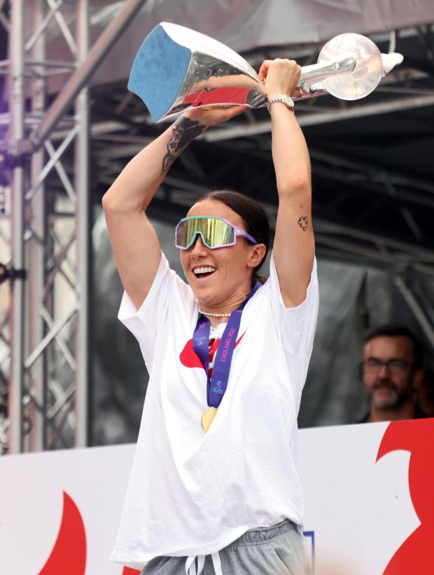 Darlington and Stockton Times: England's Lucy Bronze with the trophy on stage during a fan celebration