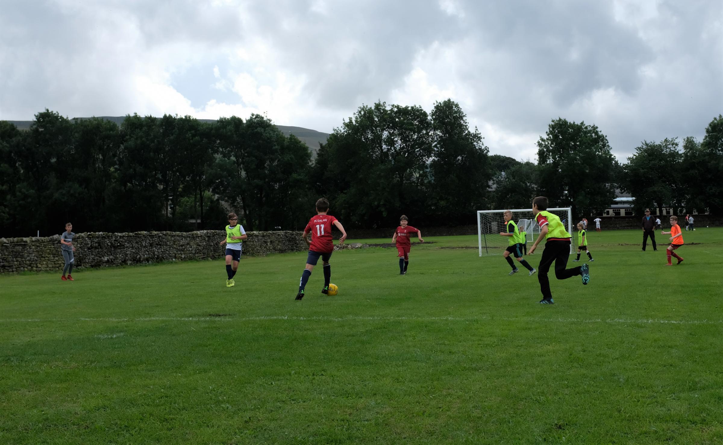 Hawes United Juniors playing football during the fun day