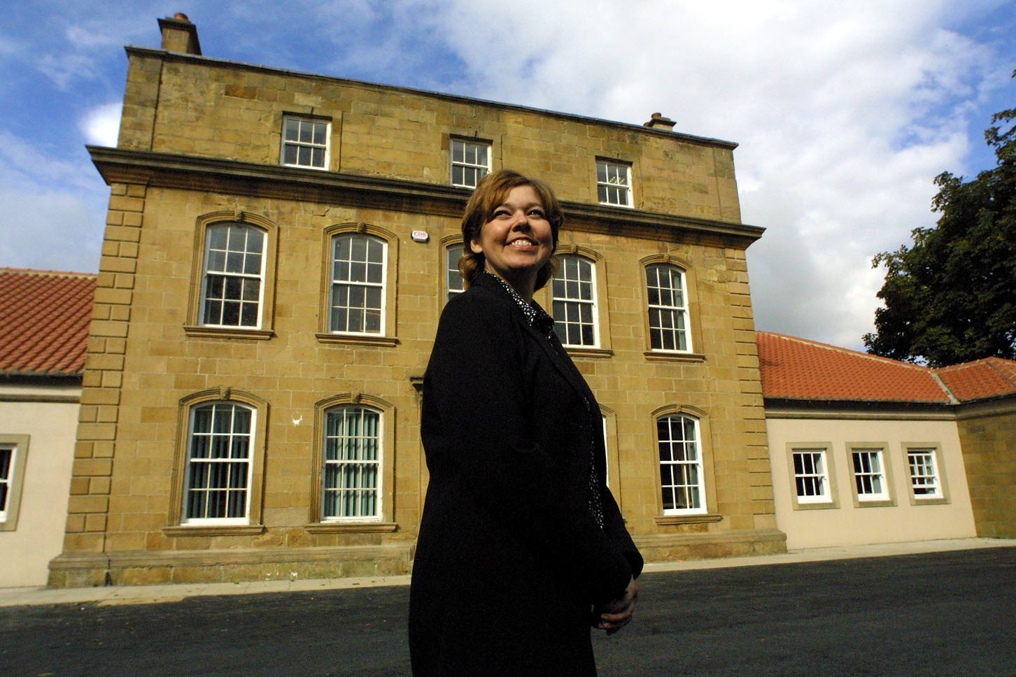 The Manor House surgery manager Helen Price in 2001 outside the Normanby doctors practice which is in the grand country home in the Rev Vyvyan Moyle