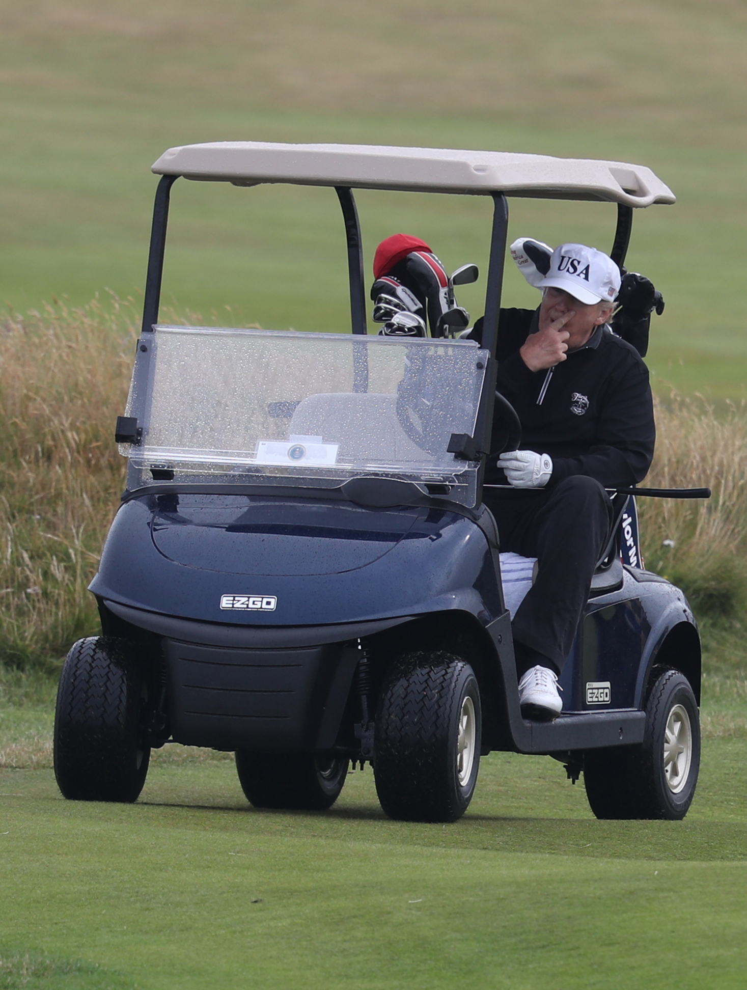 Former president Donald Trump driving an electric golf buggy on his golf course at the Trump Turnberry resort in South Ayrshire - this buggy is apparently based on the Carter Coaster, a pioneering electric vehicle designed by a Northallerton man
