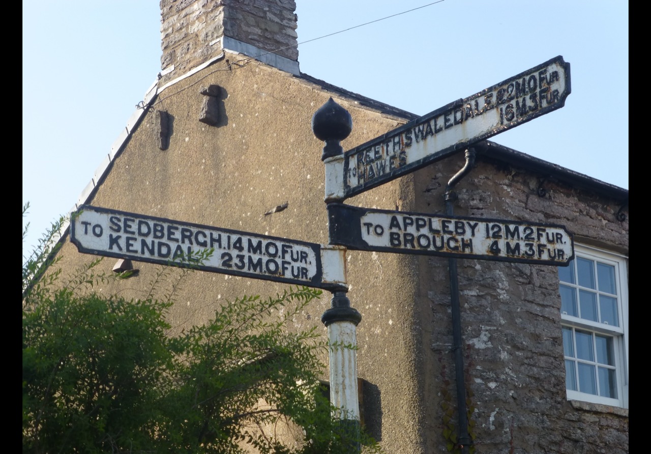 John Severs sent me this picture of a sign in Kirkby Stephen showing distances in miles and furlongs
