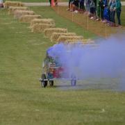 Some of the go-karts expelled coloured smoke as they whizzed along