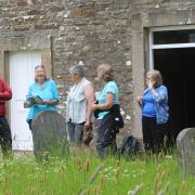Jennie White (second from left) chatting with some members of Yoredale Natural History Society outside Bainbridge Meeting House