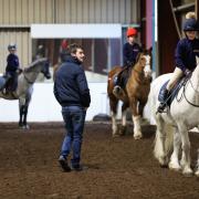 Champion jockey-elect Brian Hughes visits Kirklevington Riding Centre, near Yarm, and gives a riding lesson to a group of children. Brian with Sophia Barclay, nine, on Hector. Pictures: CHRIS BOOTH