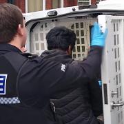 Suspect being loaded into rear of police van in Darlington. Pictures: GRAEME HETHERINGTON