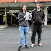 Karl (left) and Adam (right) Bracken with the parking fine they were handed by Feethams Leisure Car Park, after being parked for eight minutes too long. Picture: STUART BOULTON