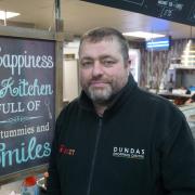 Dundas Indoor Market manager David Harris at one of its traders, Jean's Kitchen