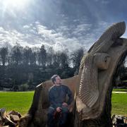 Karl Barker with the barn own sculpture at the Himalayan Gardens