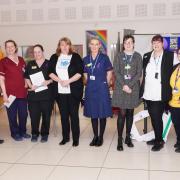 The World Delirium stand at the hospital with staff and visiting members, Nurse Anna Wilson is centre in the blue uniform with Jane Rogers immediately on her right