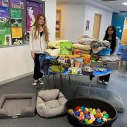 Katie Earl and Emma, the college Enrichment Co-ordinator with some of the items collected for the dogs’ rescue centre